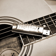 FlashHarp harmonica USB on guitar strings.
